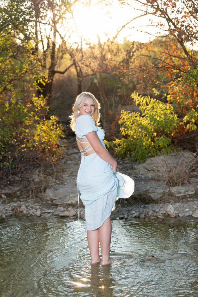 outdoor senior picture ideas fall foliage and water