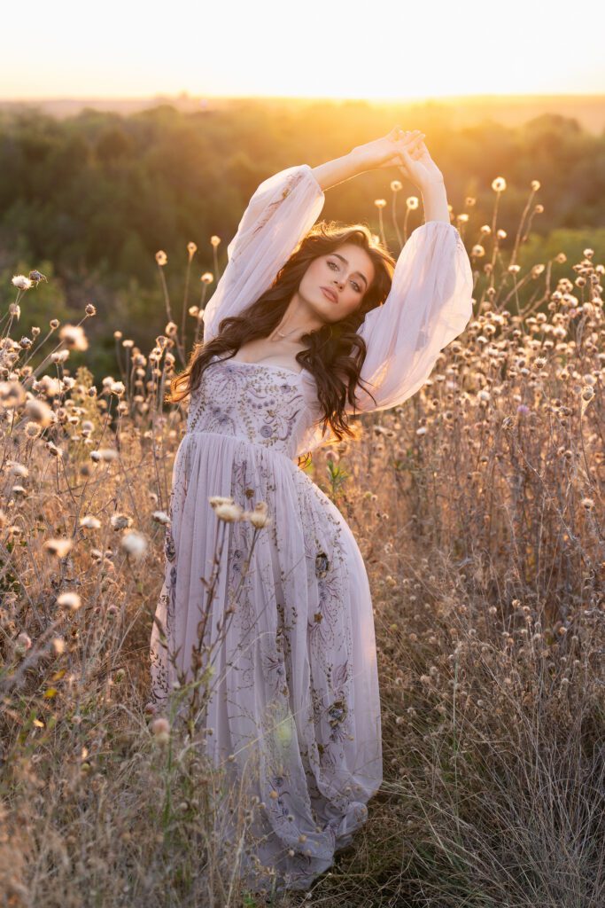 dressy senior picture idea with gown in field at sunset