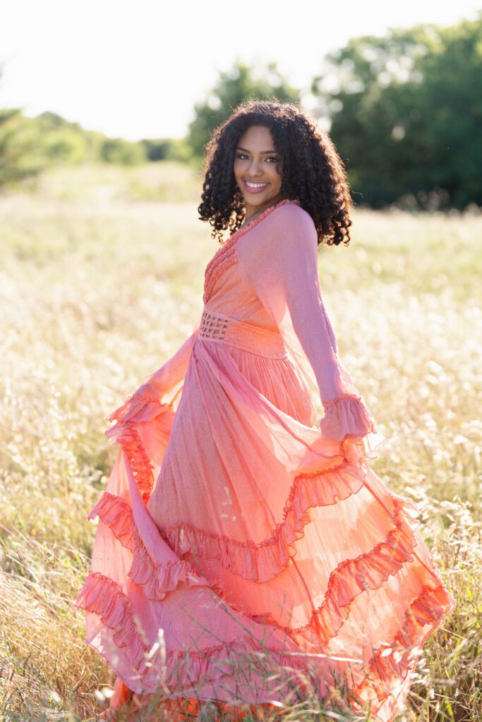 outdoor senior picture ideas in a field with long flowing dress