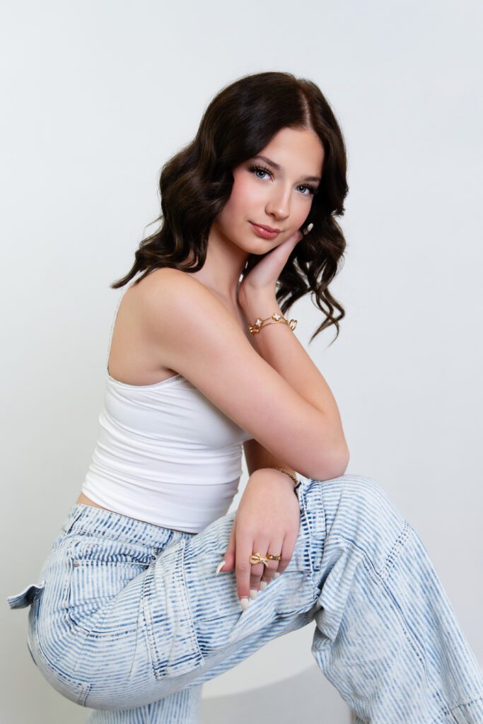 Senior girl in studio with professional lighting by angela Majerus