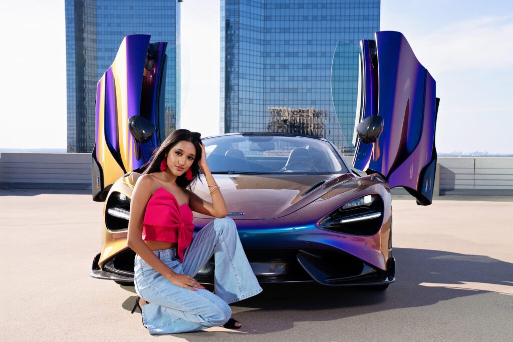 senior picture idea downtown rooftop with car
