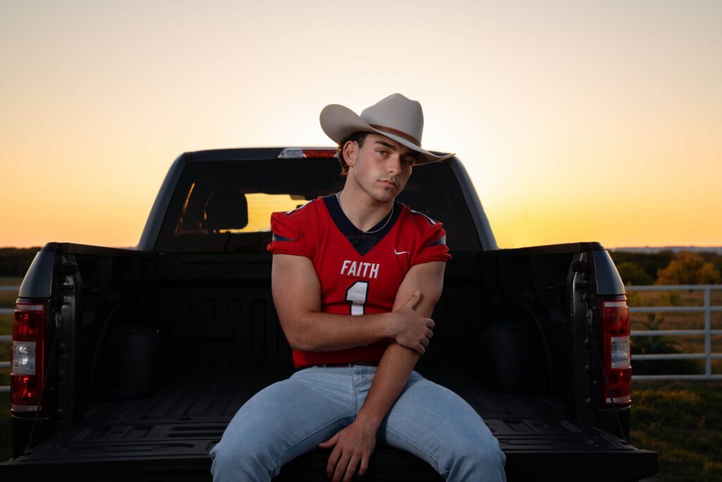 senior picture idea cowboy in truck at sunset