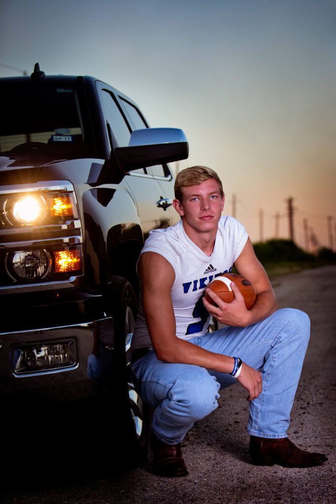 senior guy picture idea at sunset with truck and football