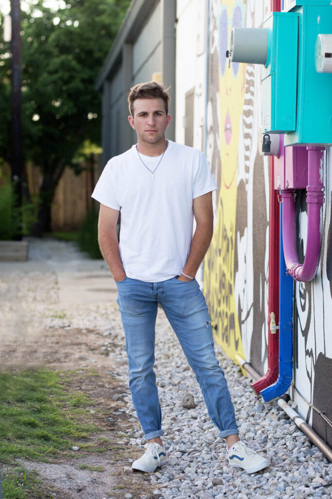 fort worth senior guy session at foundry district mural